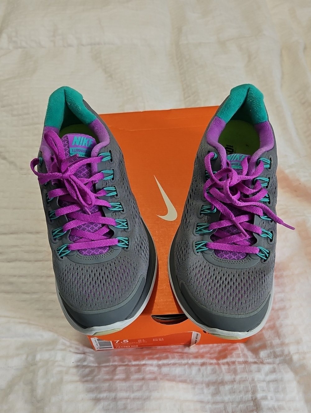 Nike Women’s Gray Athletic Shoes with Purple and Teal Accents